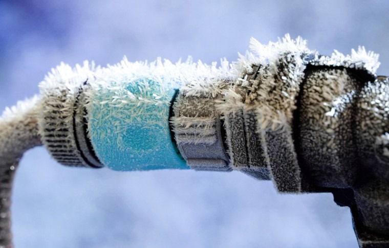Frozen water pipe with frost on it. 